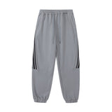 Men Sweatpants Sports Leisure Tappered Trousers with an Elasticated Waist Side Stripe Stitching Loose Zip Trousers