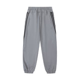 Men Sweatpants Sports Leisure Tappered Trousers with an Elasticated Waist Side Stripe Stitching Loose Zip Trousers